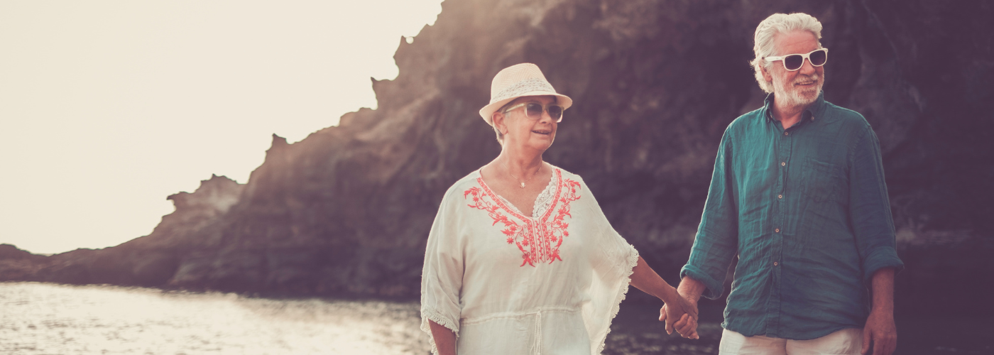 Man and woman walking on beach